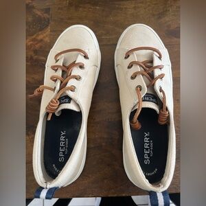 Size 8 Sperry slip on sneaker. Tan with brown and blue accents.